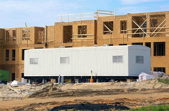 crane lifting modular building for construction office rentals in Sun Valley CA